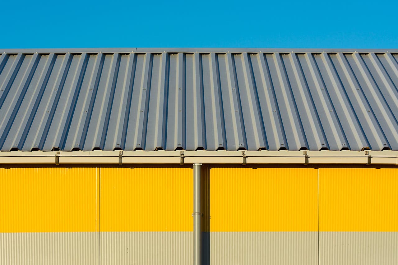 Metal roofing installation by Makoa Construction